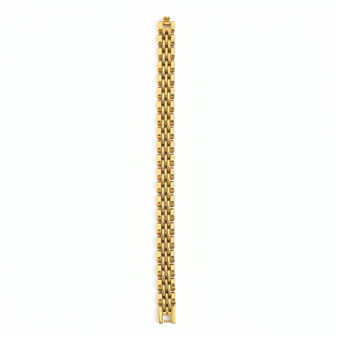 Gold bracelet on a marble surface
