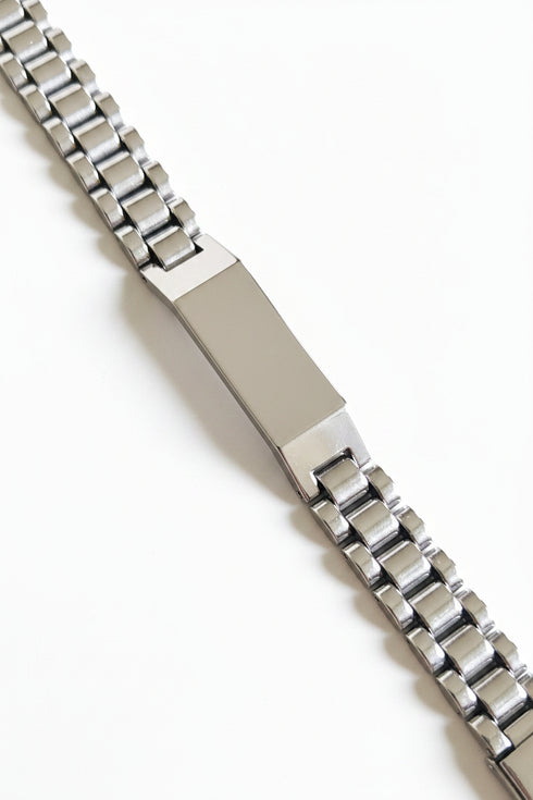 Silver watch bracelet on a marble surface
