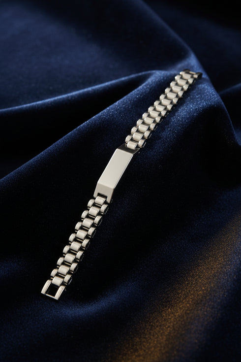 Metallic watch strap on a marble surface