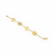Gold bracelet with various charms on a marble surface