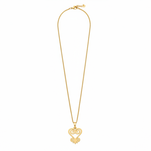 Gold necklace with a heart-shaped pendant on a white background