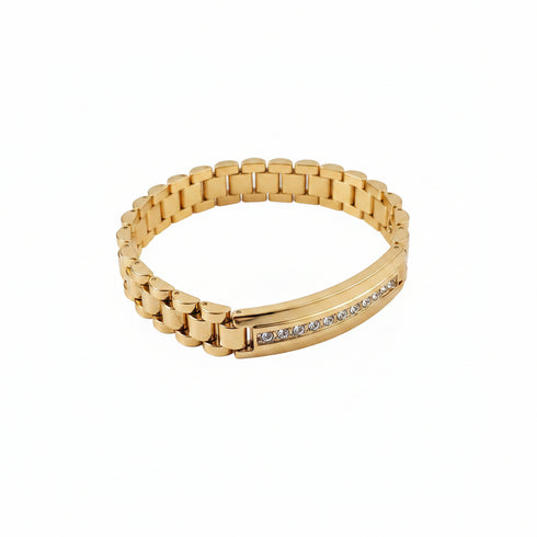 Gold bracelet with diamond accents on a white background