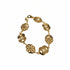 Gold bracelet on a marble surface