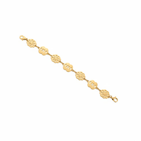 Gold bracelet on a marble surface