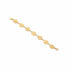 Gold bracelet on a marble surface