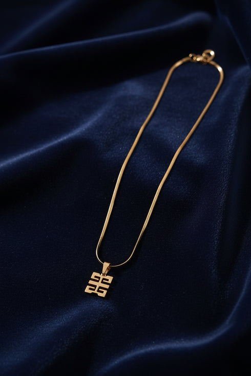Gold necklace on a marble surface