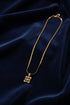 Gold necklace on a marble surface