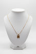 Gold necklace on a marble surface