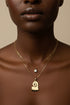 Necklace with a heart-shaped pendant on a marble surface