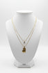 Necklace with a heart-shaped pendant on a marble surface