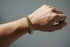 Gold chain bracelet on a marble surface