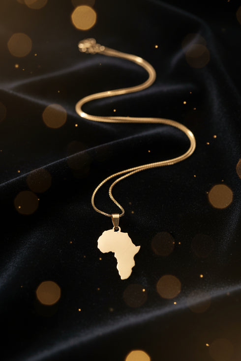 Gold necklace on a marble surface