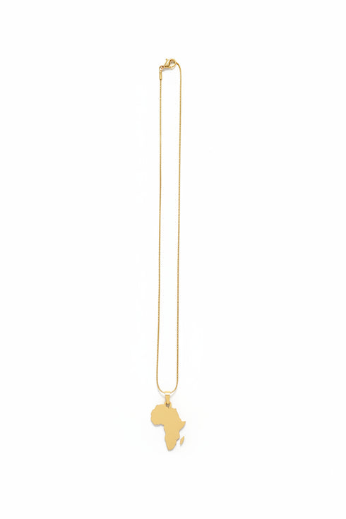 Gold brooch on a marble surface