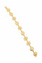 Gold bracelet on a marble surface