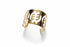 Gold bracelet with cut-out design on a marble surface