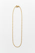 Gold necklace on a marble surface