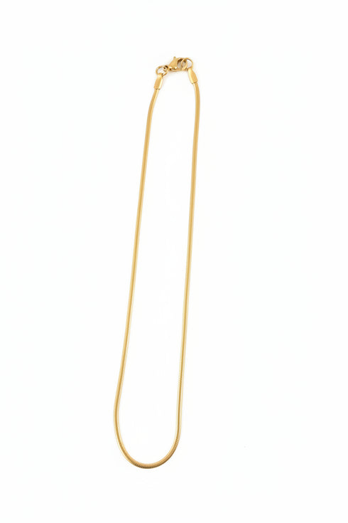 Gold hairpin on a marble surface