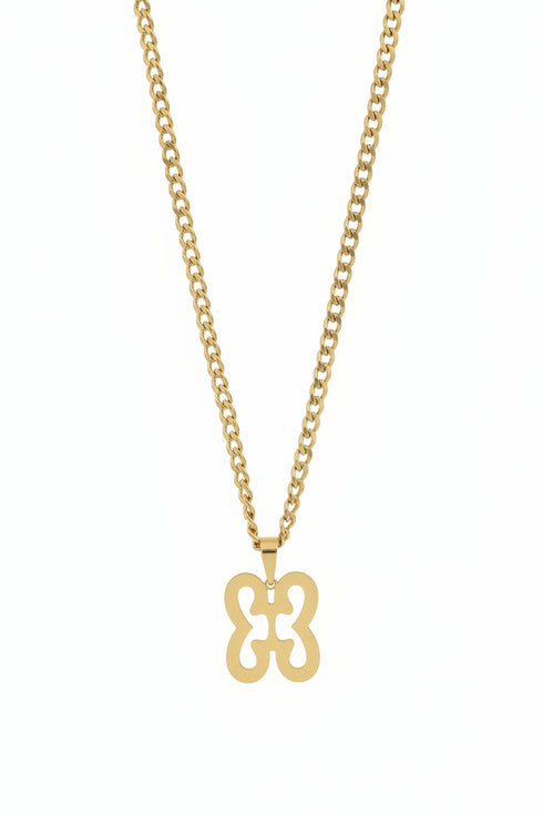 Gold chain with a decorative clasp on a marble surface