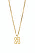 Gold chain with a decorative clasp on a marble surface