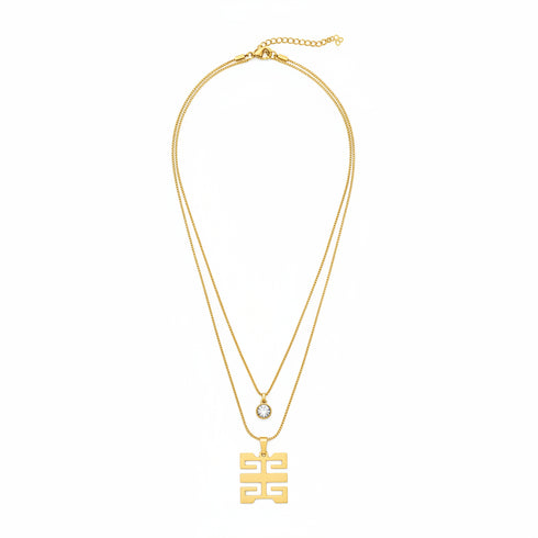 Gold necklace with a pendant on a white background