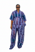 A woman modeling a matching two-piece outfit with a vibrant blue, purple, and white patterned kaftan top and wide-leg trousers, set against a plain white background.