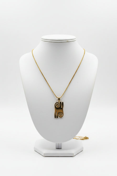 Necklace with a decorative clasp on a marble surface