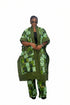 A woman modeling a green and white patterned traditional outfit consisting of a long open-front jacket, matching pants, and a black top underneath, set against a plain white background.
